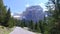 Speeding car on a winding road in the Dolomites