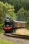 Speeding steam train, teak carridges, dining train