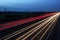 Speeding traffic on M40 motorway leaves light trails from fast moving cars.