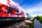 A speeding train on railroad tracks, image blurred by speed. Vivid picture.