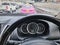 Speedometer Inside of Car Against Blurred Traffic Background
