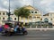 Speedy tricycle pass Ministry of Defence in Bangkok