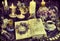 Spell book, burning black candles and dry herbs on witch table.