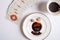 Spelling cards and cup with  coffee grounds  around white