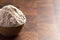 Spelt Flour in a Wooden Bowl on a Wooden Butchers Block