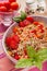 Spelt salad with tomatoes, carrots and basil