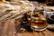 Speyside scotch whisky tasting on old dark wooden vintage table with barley grains