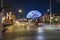 The Sphere at The Venetian Resort with lush green palm trees and cars driving on the street at night in Las Vegas Nevada