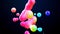 Spheres or balls merge like liquid wax drops or metaballs in-air. Liquid gradient of rainbow colors on beautiful drops