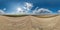 spherical 360 hdri panorama on gravel road with clouds and sun on blue sky in equirectangular seamless projection, use as sky