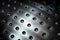 Spherical metal surface background with holes