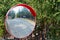 spherical road mirror at the intersection of roads