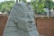 Sphinx. Concrete sphinx on display as a sculpture in a city in Brazil, South America in the background, brick wall in sight and ur