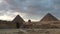 Sphinx and great pyramid of Giza at sunset panorama panning video landscape