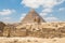 The Sphinx monument with the body of a lion and a pharaoh`s head on background pyramid of Chephren, Egypt