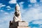 Sphinx over blue sky on Universitetskaya embankment