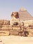 The Sphinx and pyramid in Egypt. Mysterious ancient landscape. Historical heritage. Cairo, Egypt