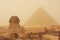 The Sphinx and Pyramid of Khafre in a sand storm, Cairo