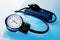 Sphygmomanometer on blue background