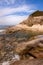 Spiaggia del Cottoncello, a free white sandy beach surrounded by smooth, white granite cliffs near Sant Andrea, Elba