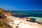 Spiaggia di Rena Majore beach with azure clear water and mountains, Rena Majore, Sardinia, Italy