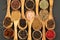 Spice and Food - Background made of many various spices and pepper varieties in small wooden bowls and cooking spoons
