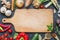 Spice herbs and vegetables food background and empty cutting board