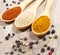 Spice powder on a wooden background. Closeup on paprika, curry and ginger.