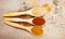 Spice powder on a wooden background. Closeup on paprika, curry and ginger.