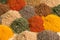 Spice and seasoning. Various fragrant spice market. Heap different Asian Spices lies on wooden background. Assortment