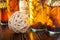 Spices bottled in oil on wooden background