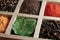 Spices in box: cummin, pepper, laurer, curry, paprika, chili