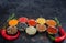 Spices. Colorful spices. Curry, Saffron, turmeric, cinnamon and otheron a dark concrete background. Pepper. Large collection of di