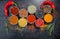 Spices. Colorful spices. Curry, Saffron, turmeric, cinnamon and otheron a dark concrete background. Pepper. Large collection of di