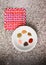 Spices on a dish over a granite countertop. Top down minimalist composition