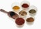 Spices in a glass bowl on a white background.