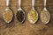 Spices and herbal tea ingredients on spoons