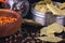 Spices and herbs, bay leaf, black pepper and wooden bowl of chili flakes