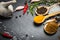 Spices and herbs over black stone background