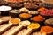 Spices and herbs in wooden bowls.