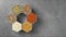 Spices in hexagonal jars on a stone surface. Stop motion animation