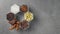 Spices in hexagonal jars on a stone surface. Stop motion animation