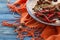 Spices mill and various aromatic herbs on plate