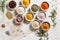 spices mixed in bowls and placed on a marble countertop, in the style of mesmerizing colorscapes