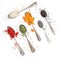 Spices on silverware spoons and white background