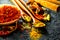 Spices. Various Indian spices on black stone table. Spice and herbs on slate background