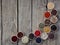 Spices on a wooden background. Coriander, black pepper, paprika, mustard, turmeric, cumin, sumac, fenugreek, cloves, cubeb.