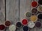 Spices on a wooden background. Coriander, black pepper, paprika, mustard, turmeric, cumin, sumac, fenugreek, cloves, cubeb.