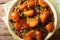 Spicy Aloo Matar potatoes, green peas and spices close-up. horizontal top view