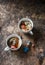 Spicy apple tea with spices cinnamon, cardamom, cloves on wooden table, top view.